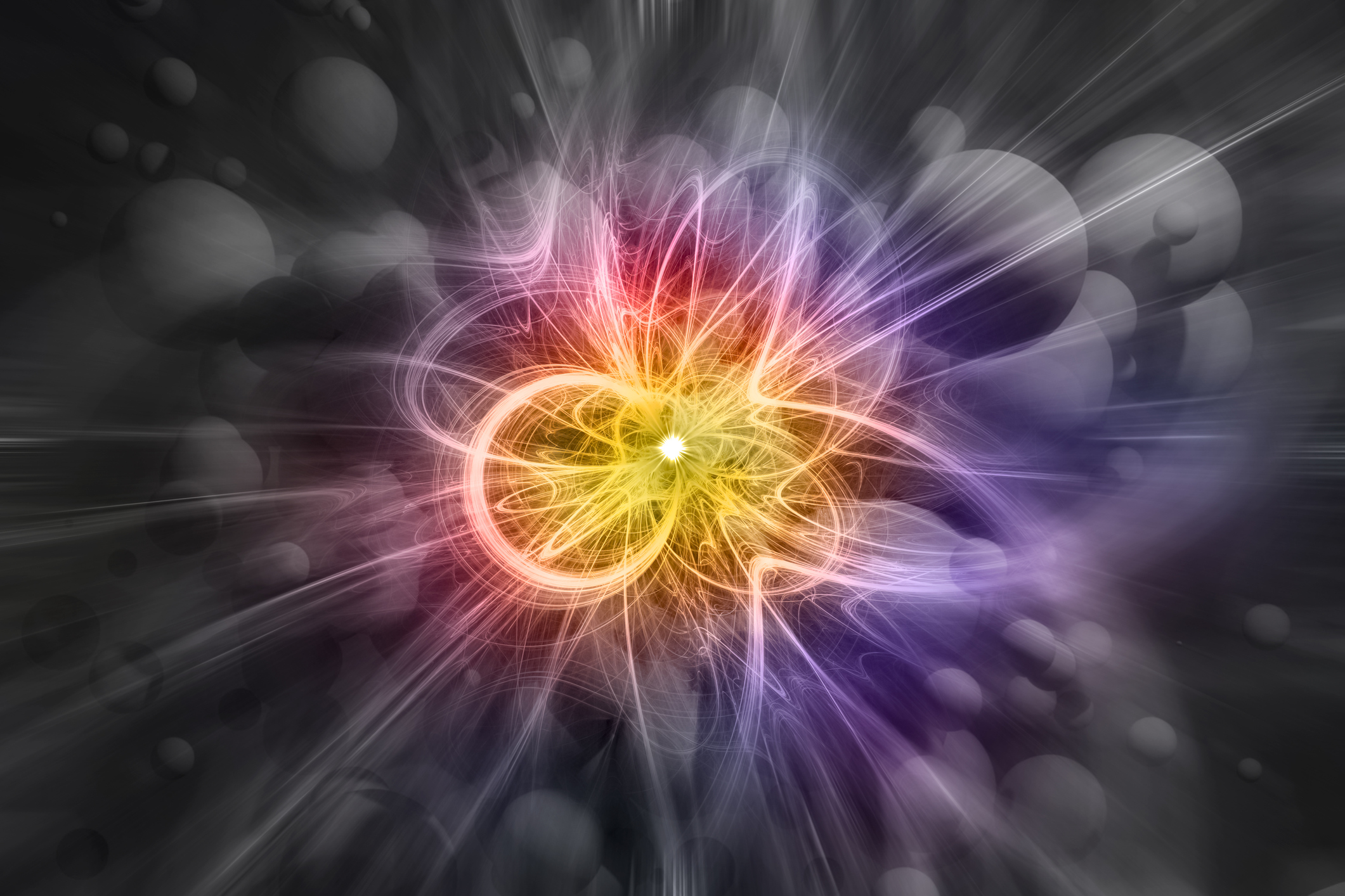 A small bright white circle with arcs of orange and red, on a grey bubble background